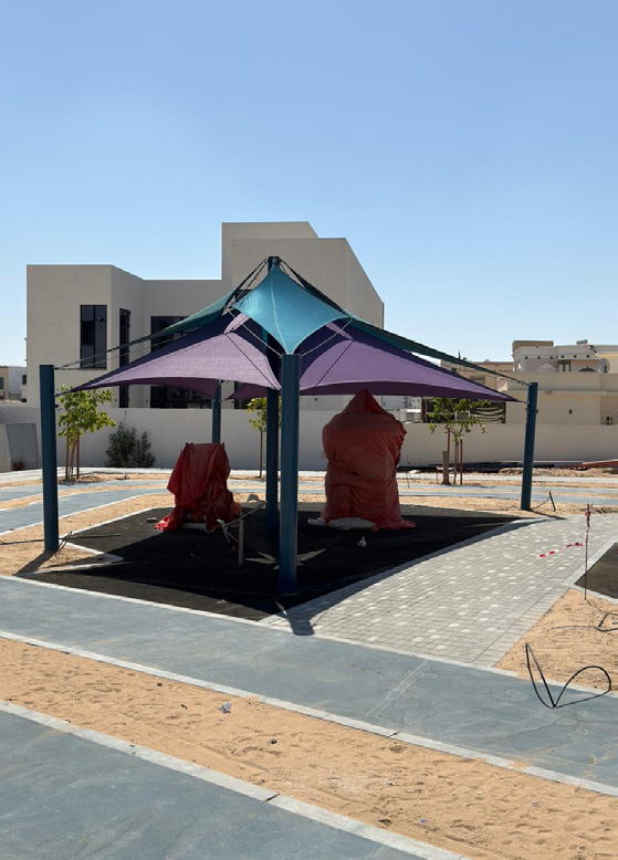 Aluminium shade pergola by Dreams over a park playground, Dubai