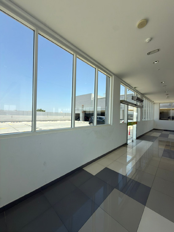 Full-height aluminium windows and glazing installed by Dreams in a commercial building