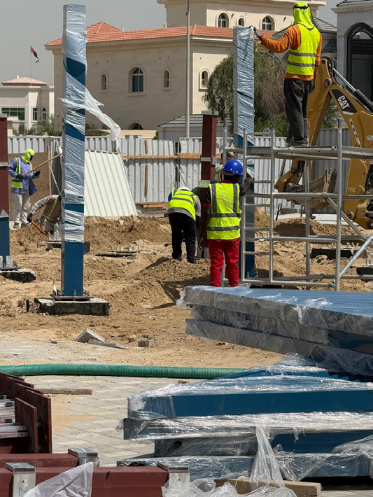 Dreams team setting out posts during a site installation