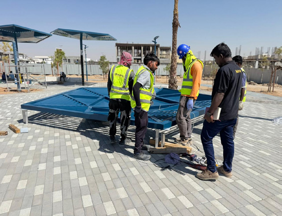 Dreams team installing an aluminium shade structure