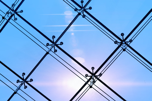 Spider glazing fittings on a glass facade (illustrative)