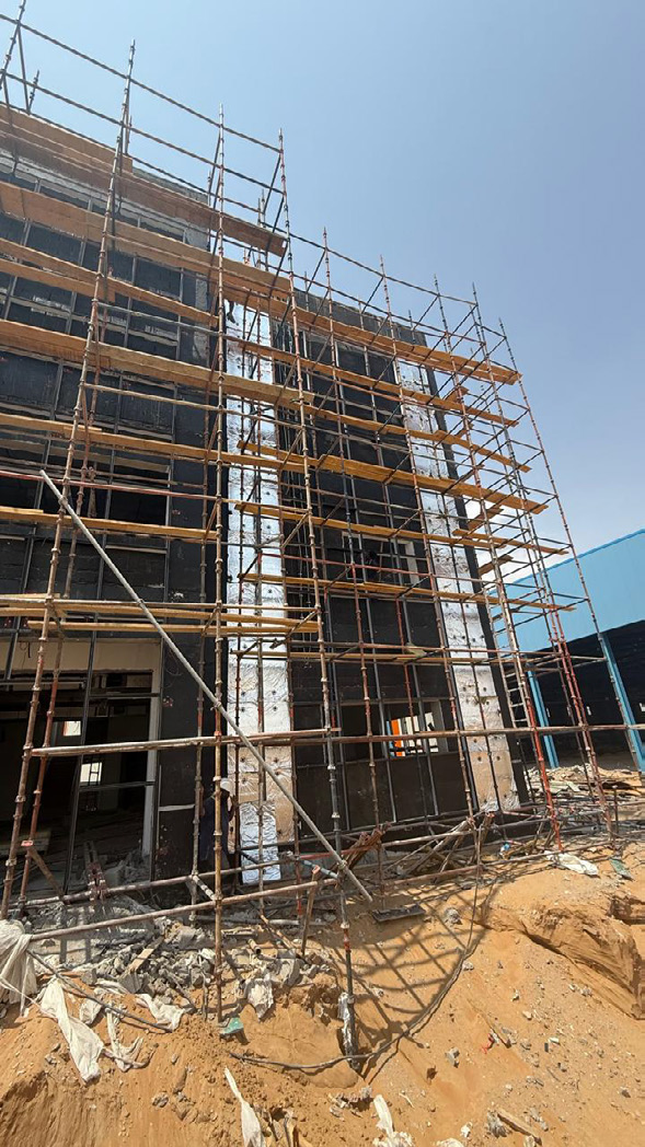 Structural glazing installation on scaffolding